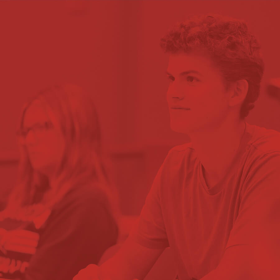Students sitting in a classroom listening to a lecture.
