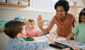 female elementary teacher with students