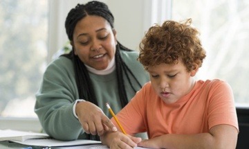 female teacher doing a lesson with student