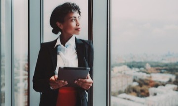 female in business at an office window