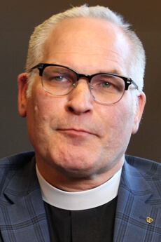 Pastor John Berg, chairperson of the Board of Regents