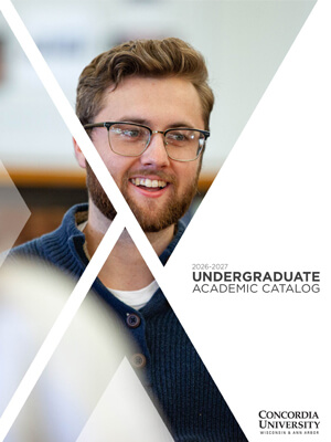 Undergraduate Catalog Cover: male student with glasses sitting the Rincker Memorial Library