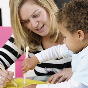 A social worker working with a child