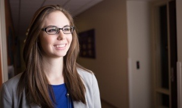 graduate student in a hallway